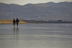 baring-our-souls:  A couple (two people) walking the Morro Strand