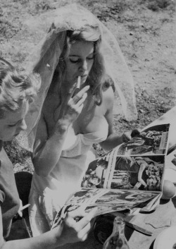 updownsmilefrown:  Brigitte Bardot takes a break from filming
