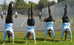 schooluniformpantyhose:  Four girls in tights practicing handstands.