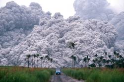 A pickup truck flees from the pyroclastic flows spewing from