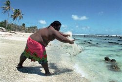 men-in-full:  Nauru man fishing in reef.