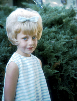  Snap shot of a young girl with her new bouffant hair style,