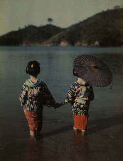 natgeofound:  Modestly attired Japanese women wade into water