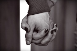 “His hand glides down my arm, folds over my hand. His fingers