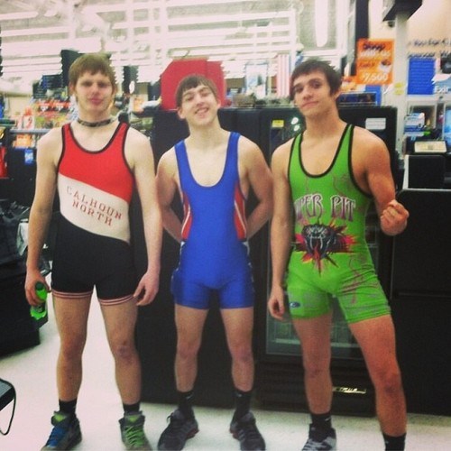 Wrestling champs out shopping they way they were always meant to be–in singlets. 