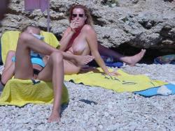 yourcandidbeach:  Nudist wife having a cigar break from tanning