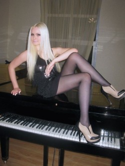 tightsobsession:  Long legs in sheer pantyhose on a piano. Tights