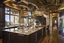 homestratosphere:  This gorgeous kitchen features soaring exposed