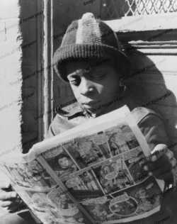 superheroesincolor:  African american boy reading comics (1940s)