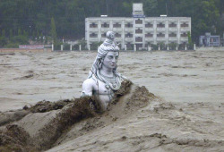 skinnyknees:  A submerged statue of the Hindu Lord Shiva amid