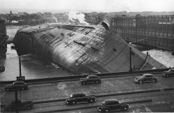 French liner SS Normandie after she caught fire and capsized.