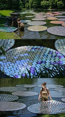 thechocolatebrigade:  65,000 Recycled CDs Form Colorful Floating