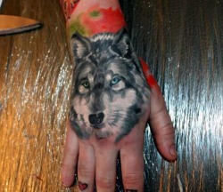 LONE WOLF HAND TATTOO