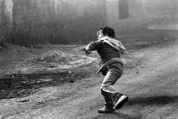 fatigatti:  A Palestinian boy throws a rock during the first