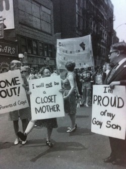 everythingstartsfromsomething:Parents at a gay pride parade in