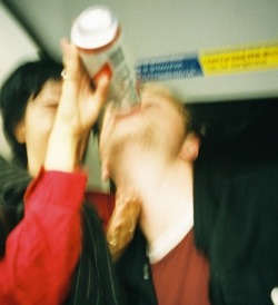 videoscript:  Zoe feeding Cam a red stripe on the tube.