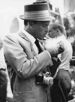 es-eternalstyle:  Frank Sinatra in Berlin lighting a cigarette