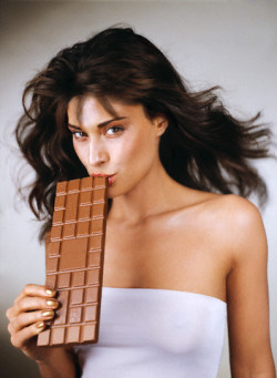 womans-day:  Woman biting the corner of an oversized chocolate