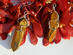 whismstore:  Semi precious tiger’s eye wire wrapped crystal!