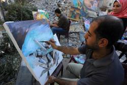 momo33me:  Palestinian artists do paintings over the rubble of