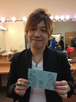 The commissioner sent me a photo of mister Naoki Yoshida holding