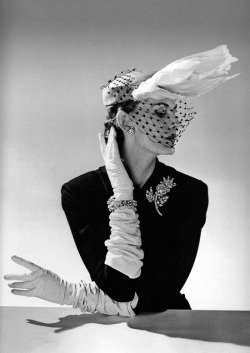 theniftyfifties:  Model wearing a hat with veil and gloves, 1951.