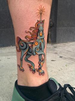 fuckyeahtattoos:  My Robot Unicorn on roller skates, done by