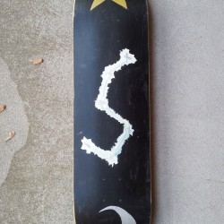 Space type skateboard deck bottom. There’s a star and a