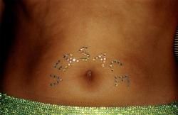 sadesmoothoperator: Swarovski-crystal belly tattoos at Versace.