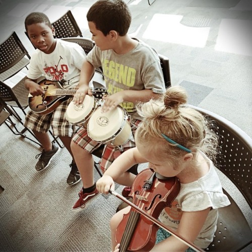 <p>A beautiful afternoon at the Goodlettsville Public Library sharing instruments with dozens of eager kids. I told these three they should be a band, so they decided to be one. This is their first rehearsal. #countrymusicisforeveryone #fiddle #mandolin #cmhof #wecanalljustgetalong @officialcmhof @adamollendorff  (at Goodlettsville Public Library)</p>