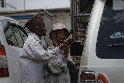 Man-Woman beggar team soliciting donation. Bandung, Indonesia