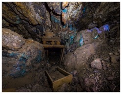 neonconflagrations:  inside of an abandoned mine lit only with