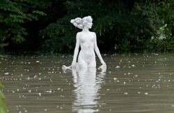  A statue in the floodwater of the Moson branch of River Danube