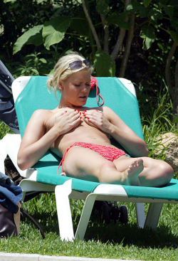 toplessbeachcelebs:  Suzanne Shaw (British Actress) sunbathing