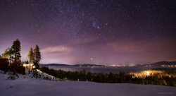 space-pics:  Vibrant winter stars over Lake Tahoe, a week ago.