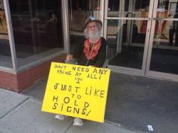 stunningpicture:  A man who just likes to hold signs in Ithaca,