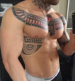 Great pecs, awesome ink work - WOOF