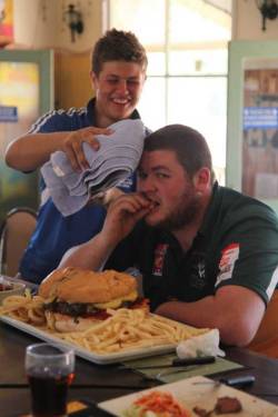 The boy has a healthy appetite (Road Train Burger and fries at the Nindigully Pub, Queensland, Australia)