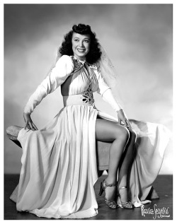 Couchita Vintage promo photo dated from April of &lsquo;43.. The reverse side of the photo mentions her scheduled appearance at 'The L &amp; L Café&rsquo; in downtown Chicago..