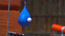 sizvideos:  Shooting a golf ball at a ballon filled with non-Newtonian
