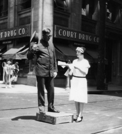   Traffic policeman has a tea break at Broadway and 11th Street,