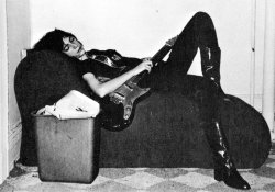 pinkfled:  Patti Smith captured sleeping with her guitar.