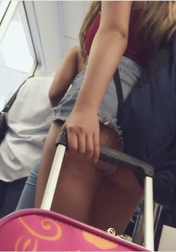 jcstud:  Hot Chic in denim shorts at LAX security check point
