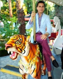 Lord Scott Disick, pictured mounting his regal Bengal tiger,