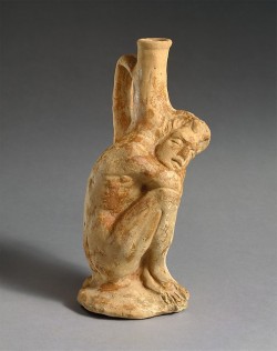 ancientpeoples:  Terracotta vase in shape of sleeping person From
