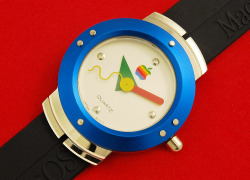 1984 Apple/Mac watch promo for the Mac with PoMo graphics.