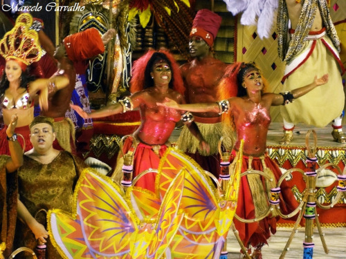 Topless and body painted at a Brazilian carnival, by Marcelo Carvalho.   