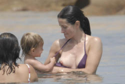 toplessbeachcelebs:  Courtney Cox (Actress) bikini nipple slip