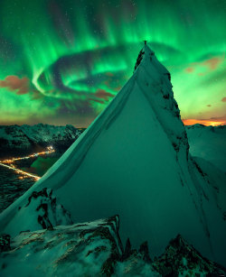 humanoidhistory:  Man, mountain, and aurora — The aurora borealis