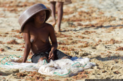 Topless Madagascan fisher girl.